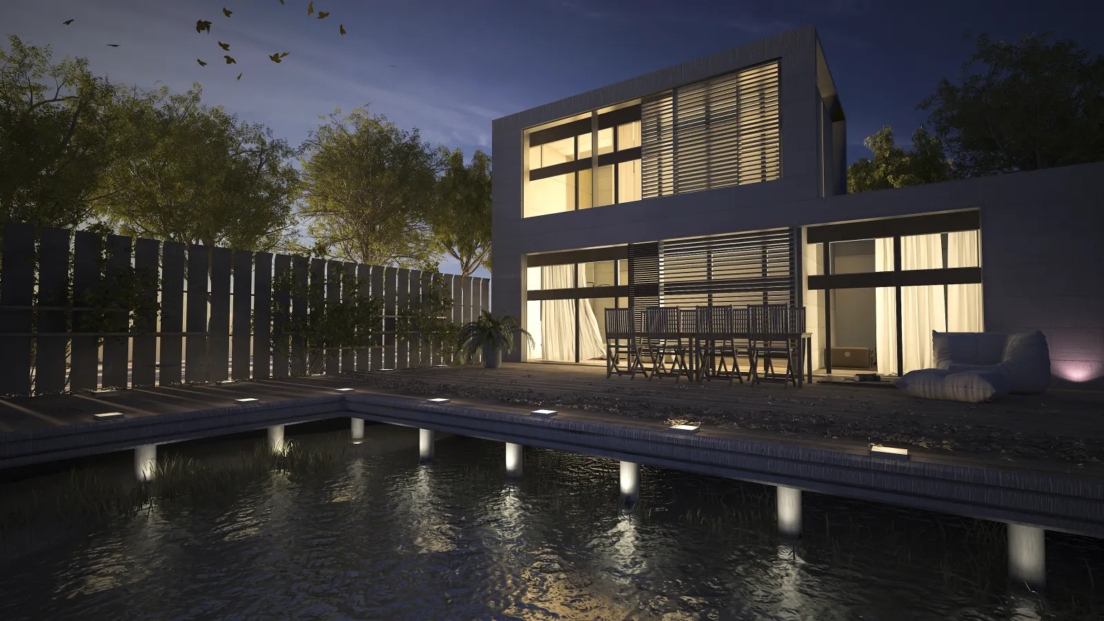 Modern two-story house at night with illuminated windows, outdoor dining area, and pool reflection.