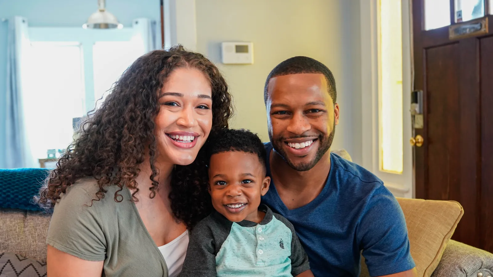 a family smiling for a picture