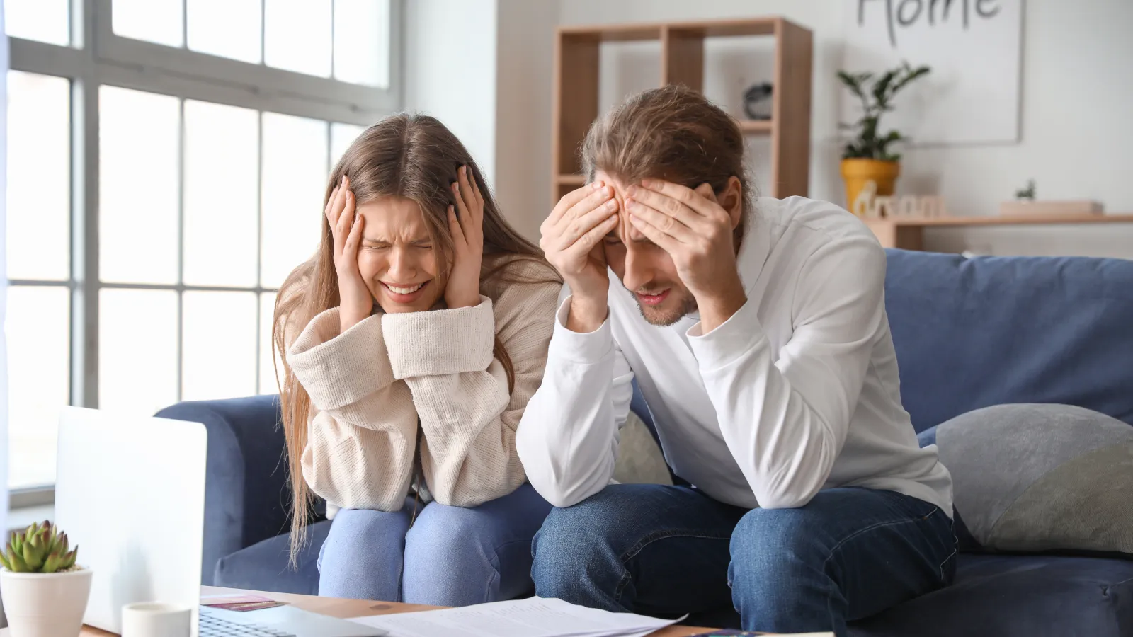 a man and a woman sitting on a couch