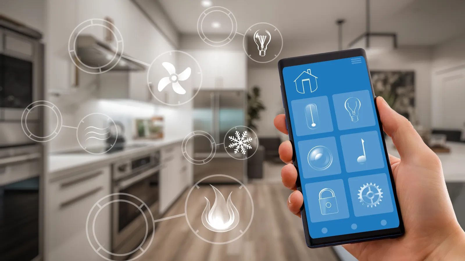 Hand holding smartphone displaying home automation app controlling lighting, temperature, and security in modern kitchen.