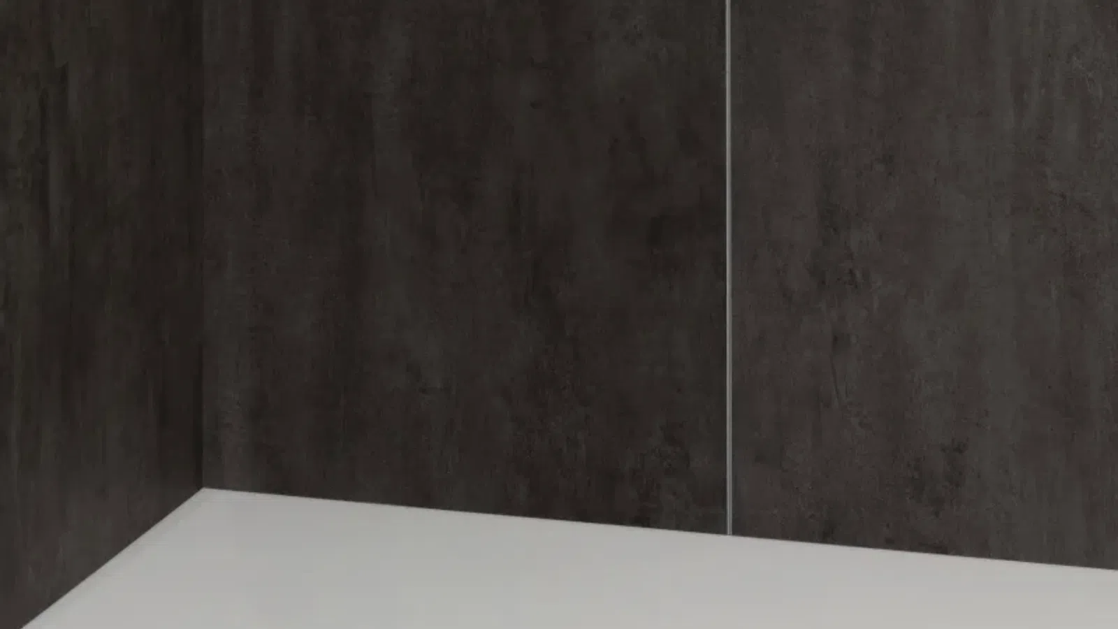 Modern shower corner with dark textured walls and a white base featuring a circular drain. w