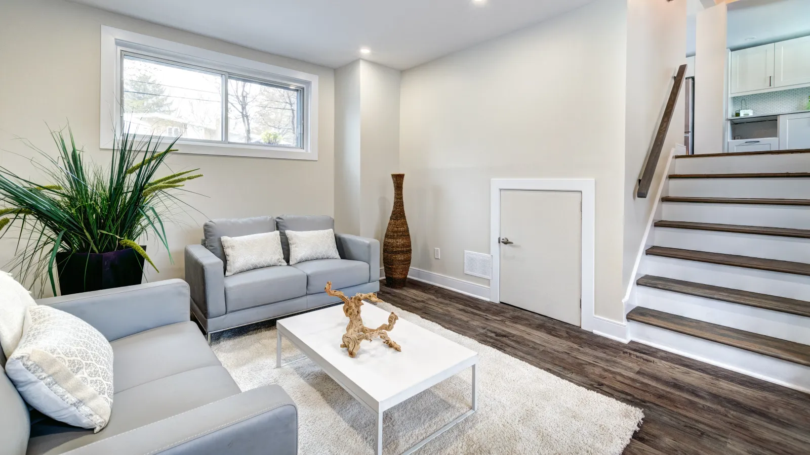 a living room with a staircase