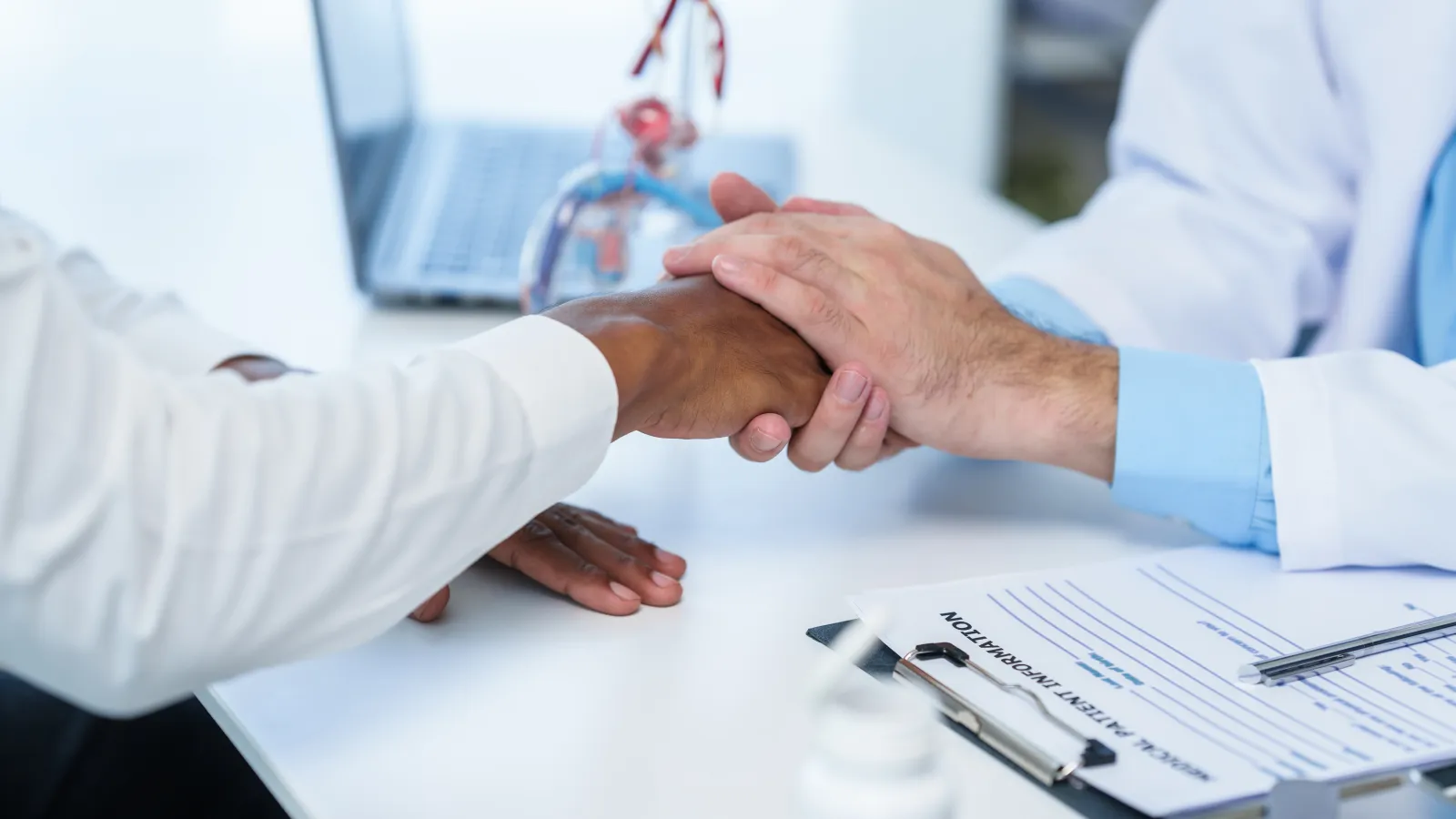 close-up of people shaking hands