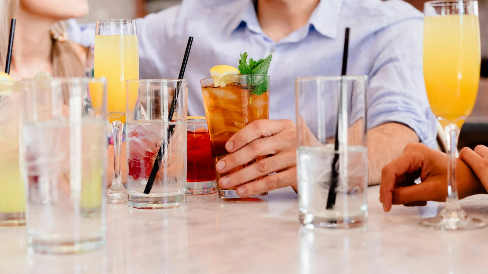 a group of people holding drinks