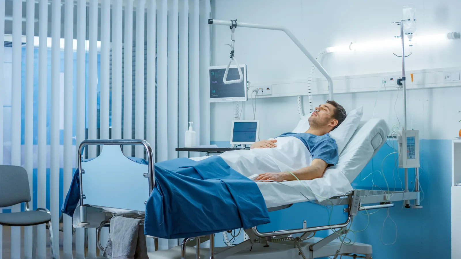 a person lying in a hospital bed