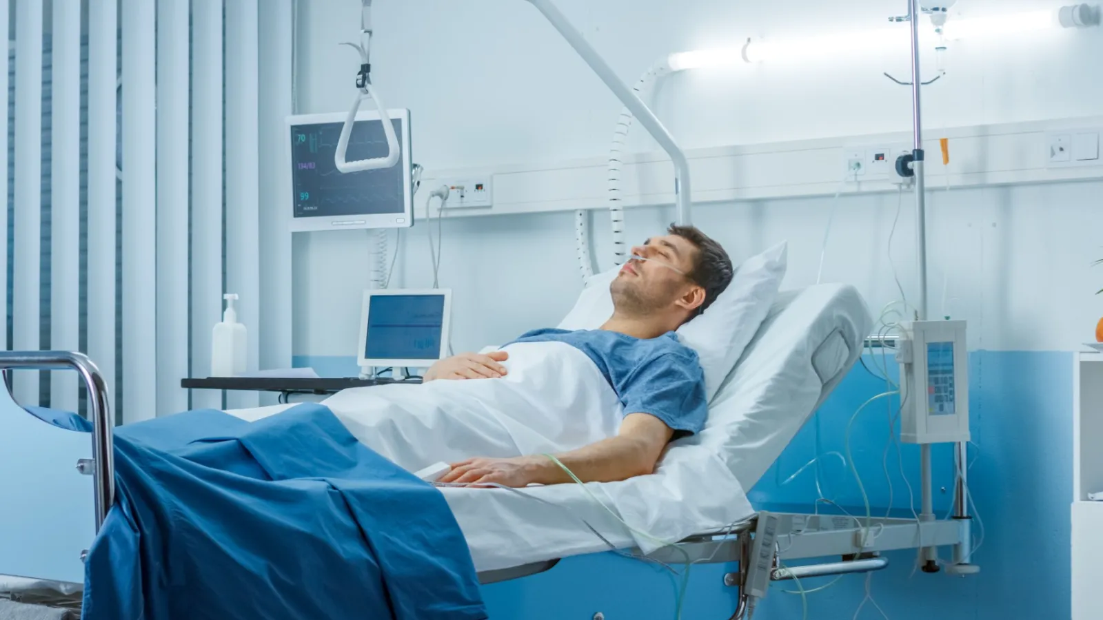 a person lying in a hospital bed