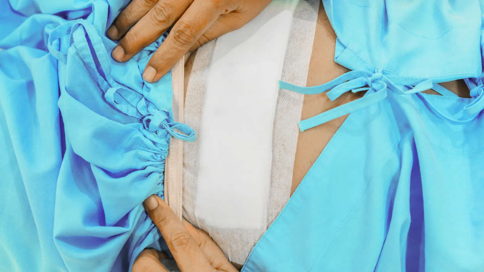 a person holding a blue and white cloth