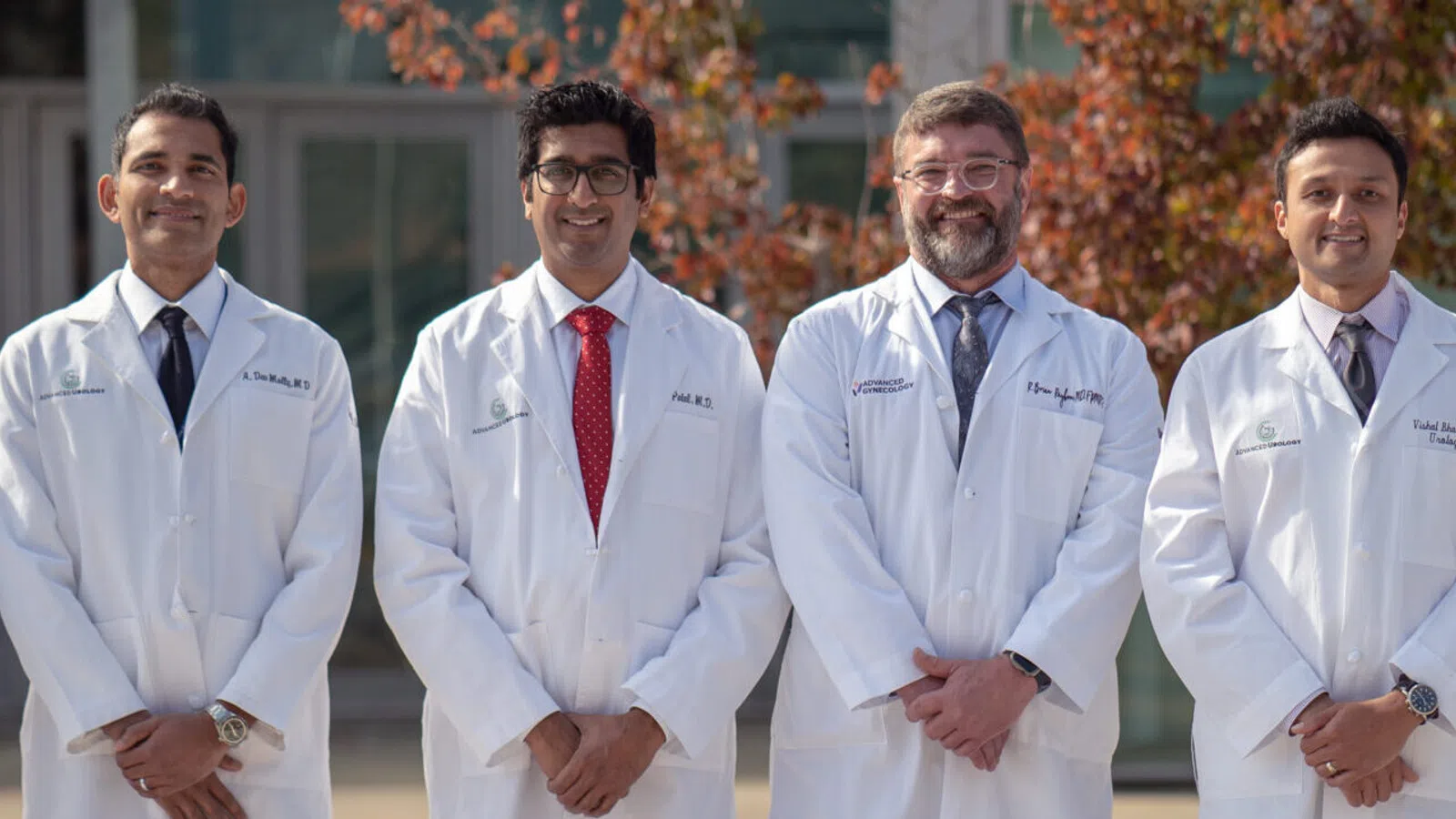 a group of men in white lab coats