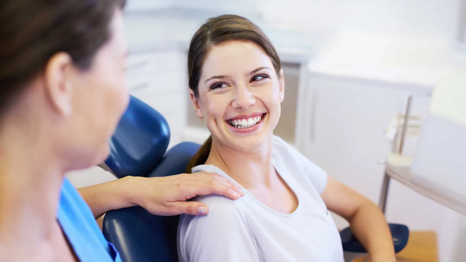 a woman smiling at a man