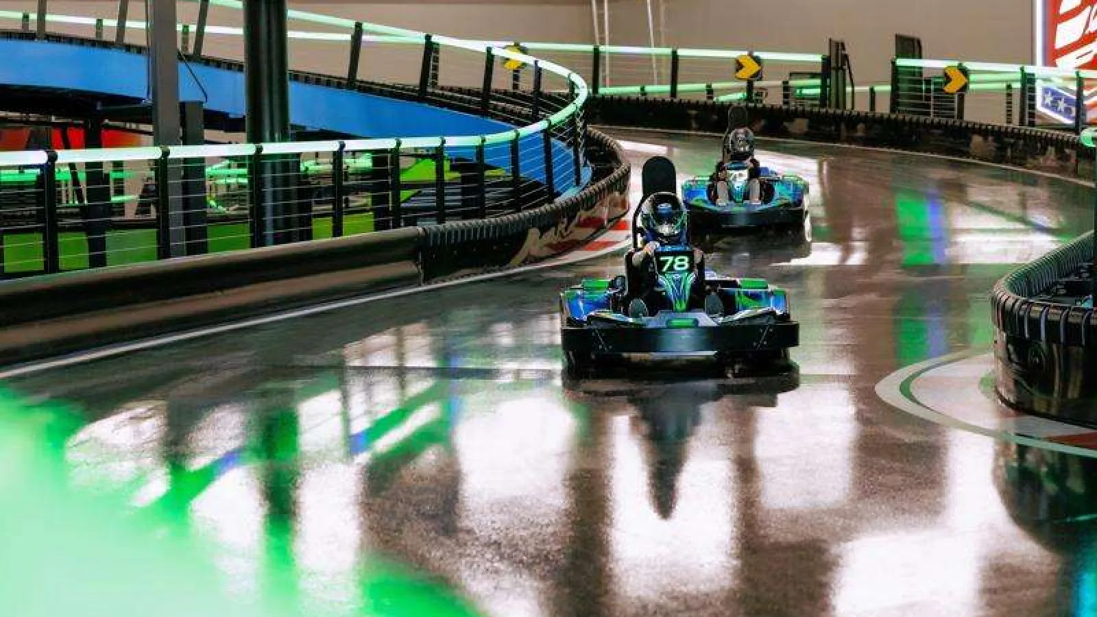 a group of people in go-karts on a track