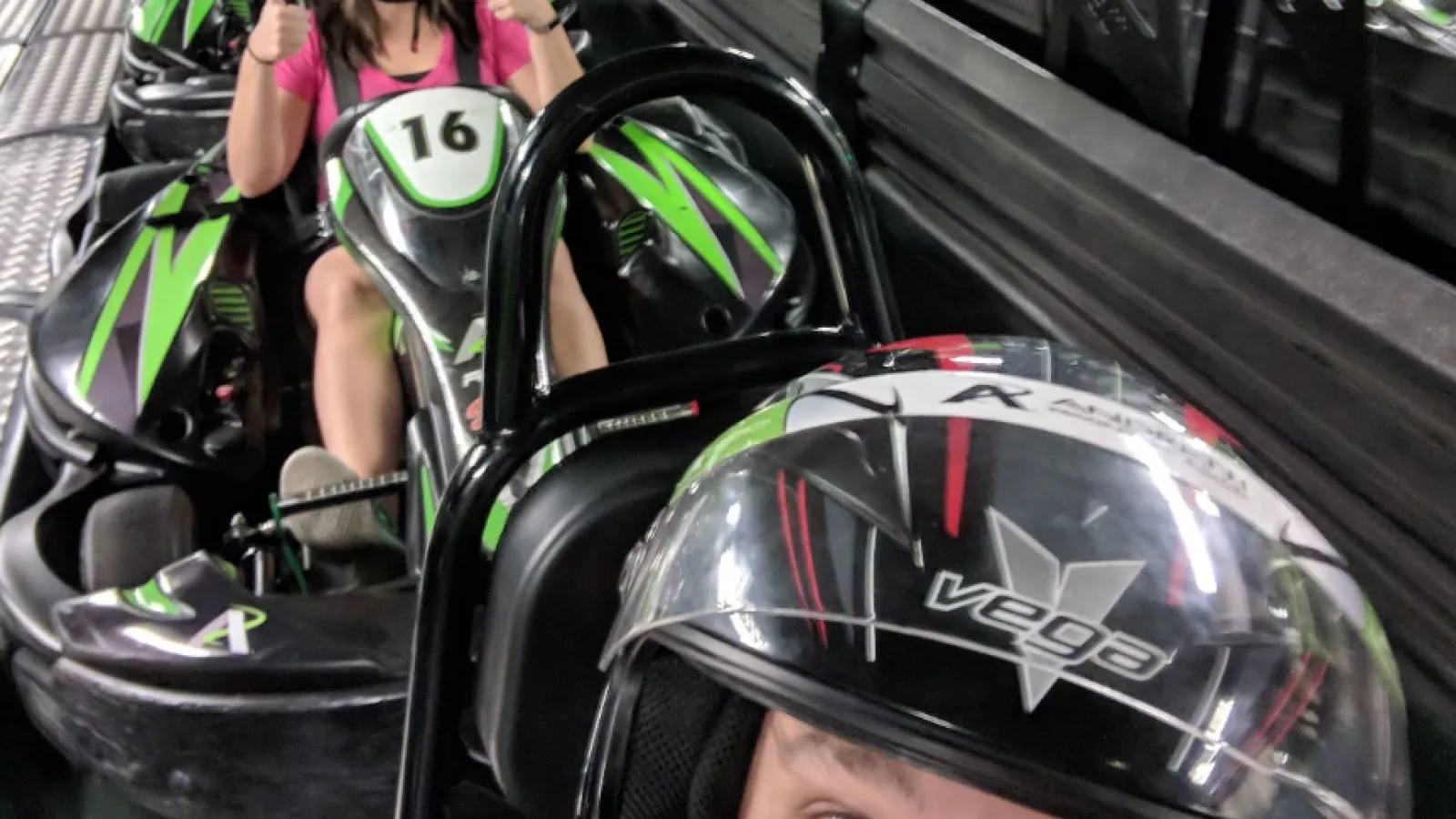 a group of people riding go carts