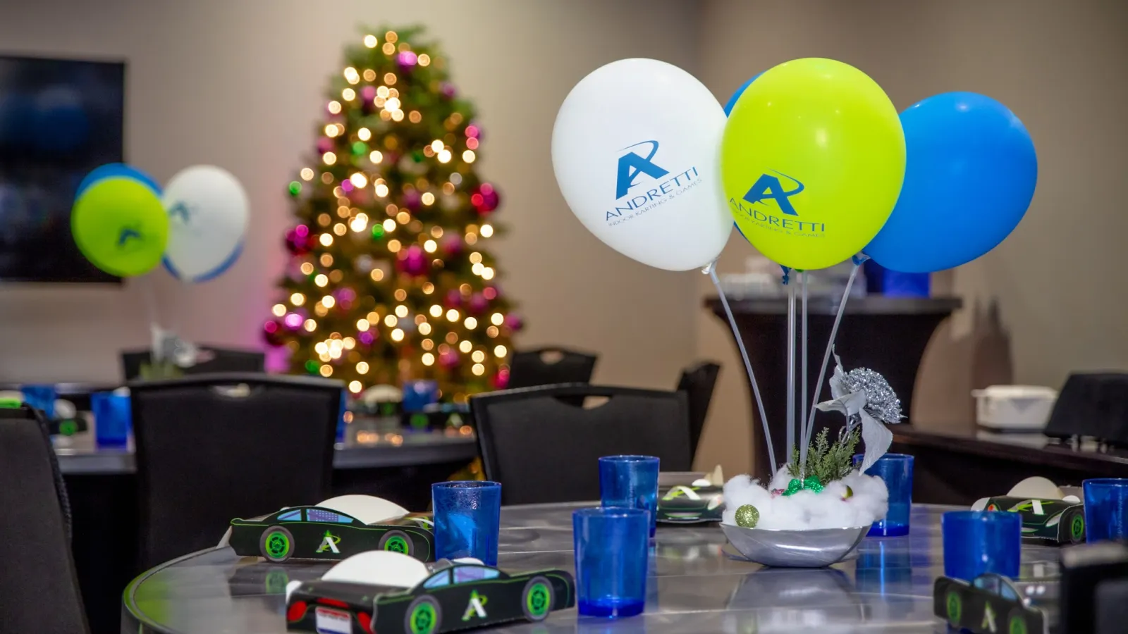 a christmas tree with balloons around it