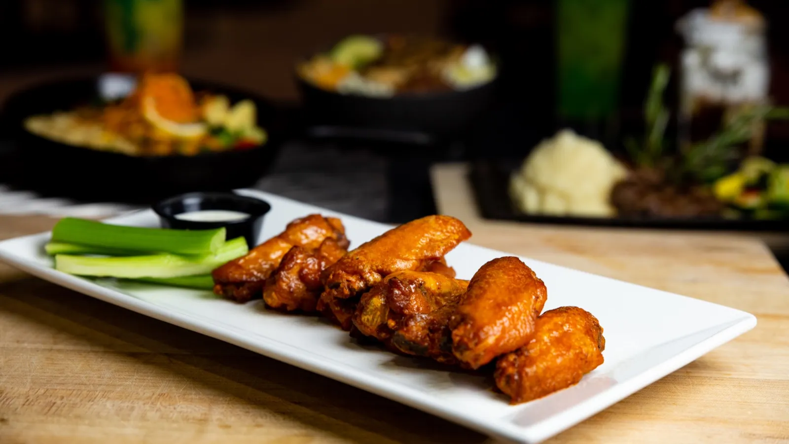 a plate of food sitting on top of a wooden table