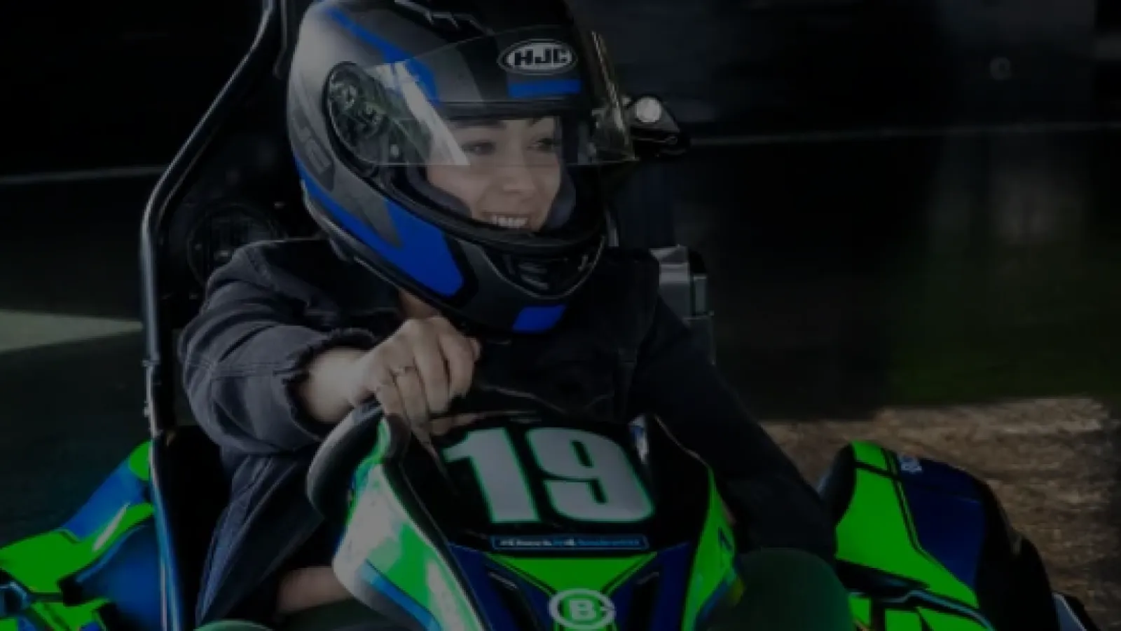 a person in a helmet in a vehicle