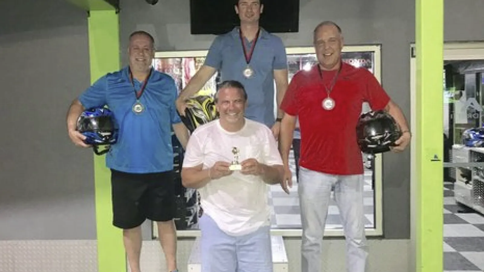 a group of men posing for a photo