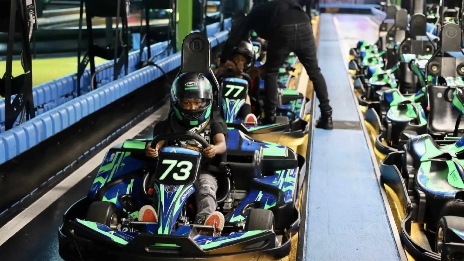 a group of people in go-karts