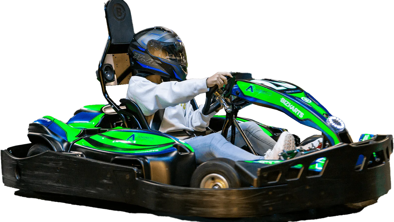 Person wearing helmet driving a green and blue electric go-kart on a black go-kart frame.