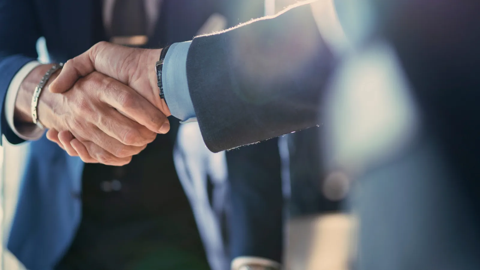 close-up of people shaking hands