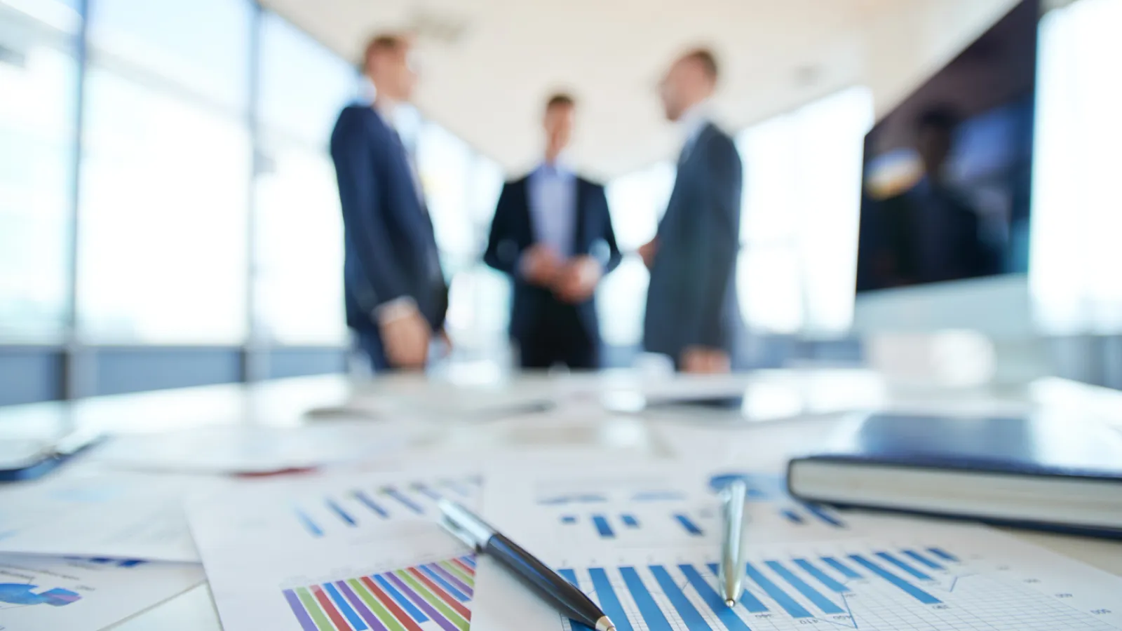 a group of people in a meeting