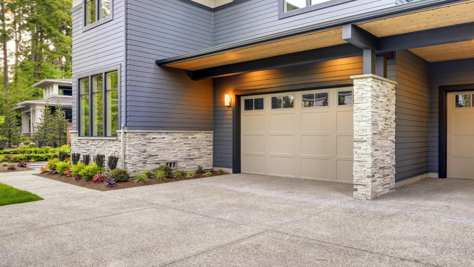 a house with garages and a driveway