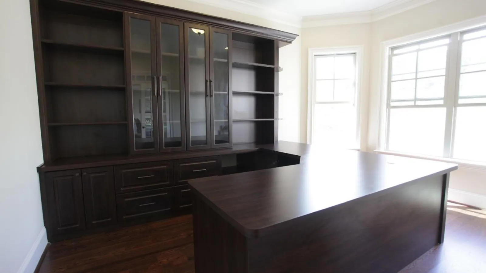 a room with a table and shelves