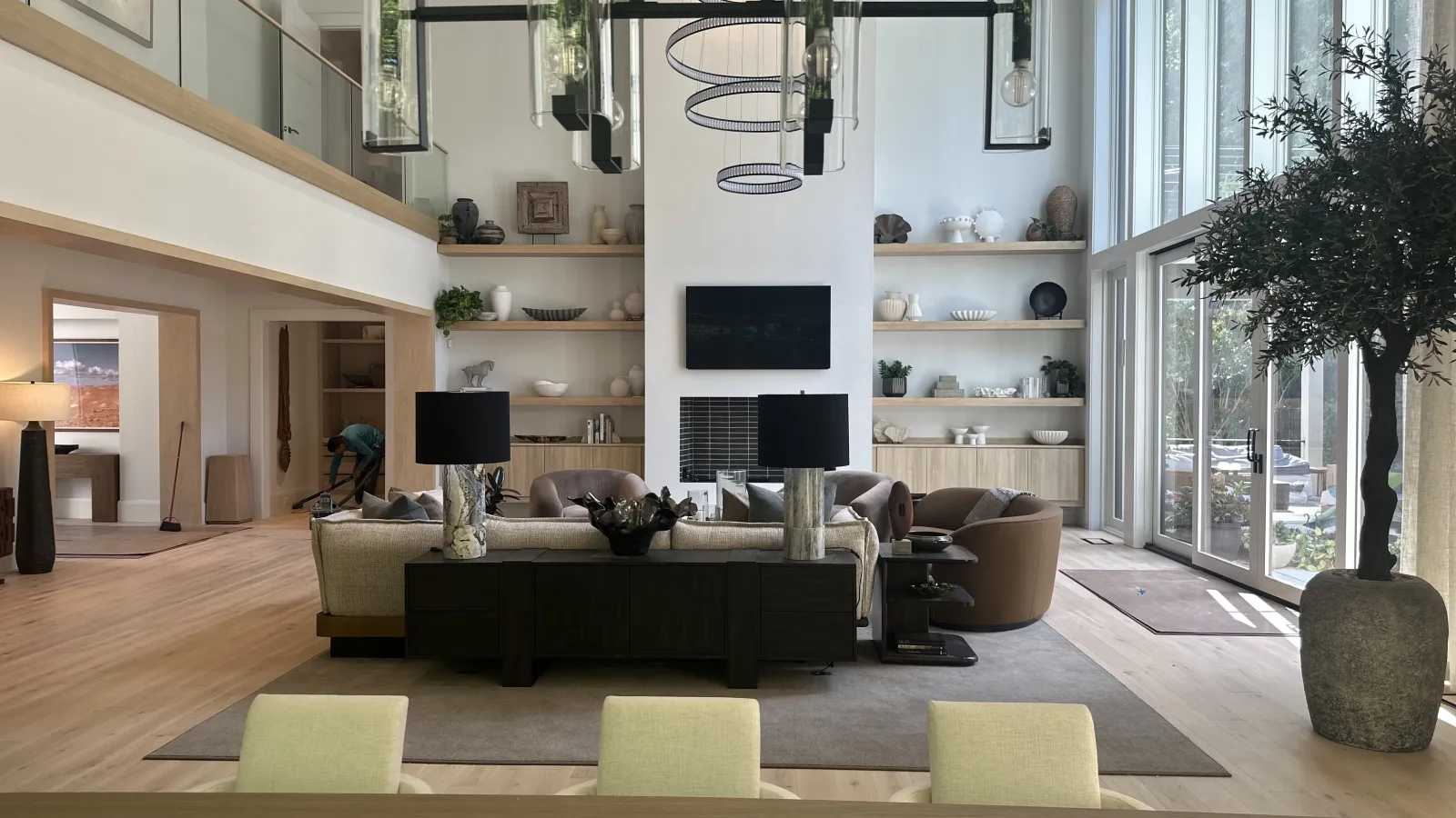 a living room with a large glass wall