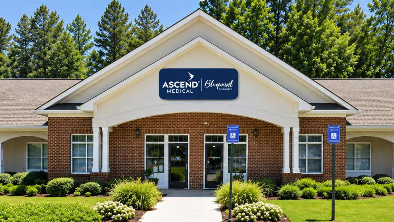 Brick medical office building with Ascend Medical Blueprint sign, wheelchair parking, and green landscaping.