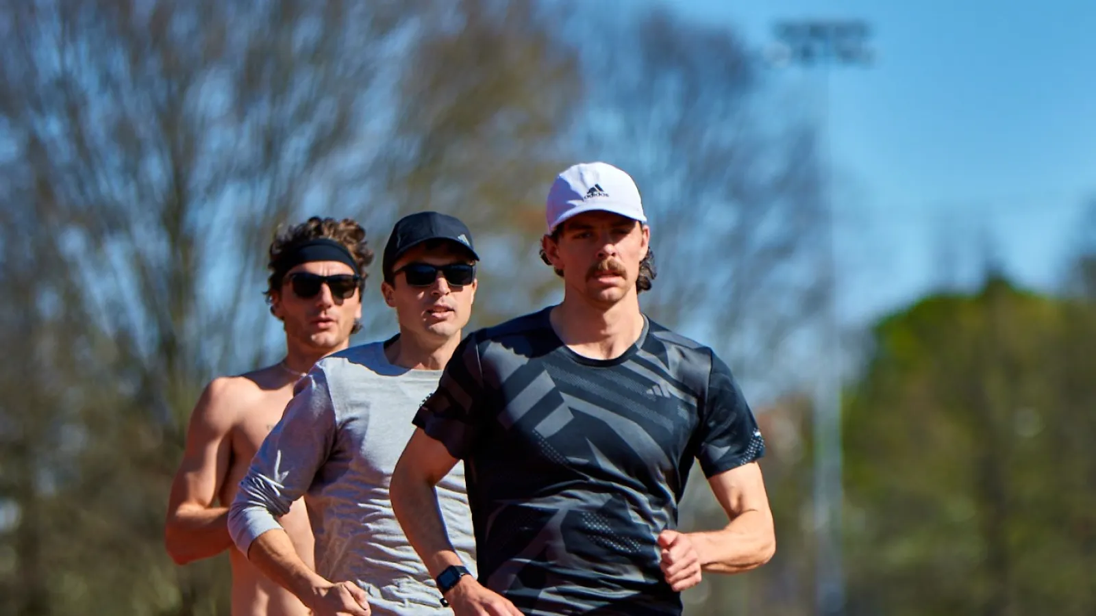 a group of people running on a track