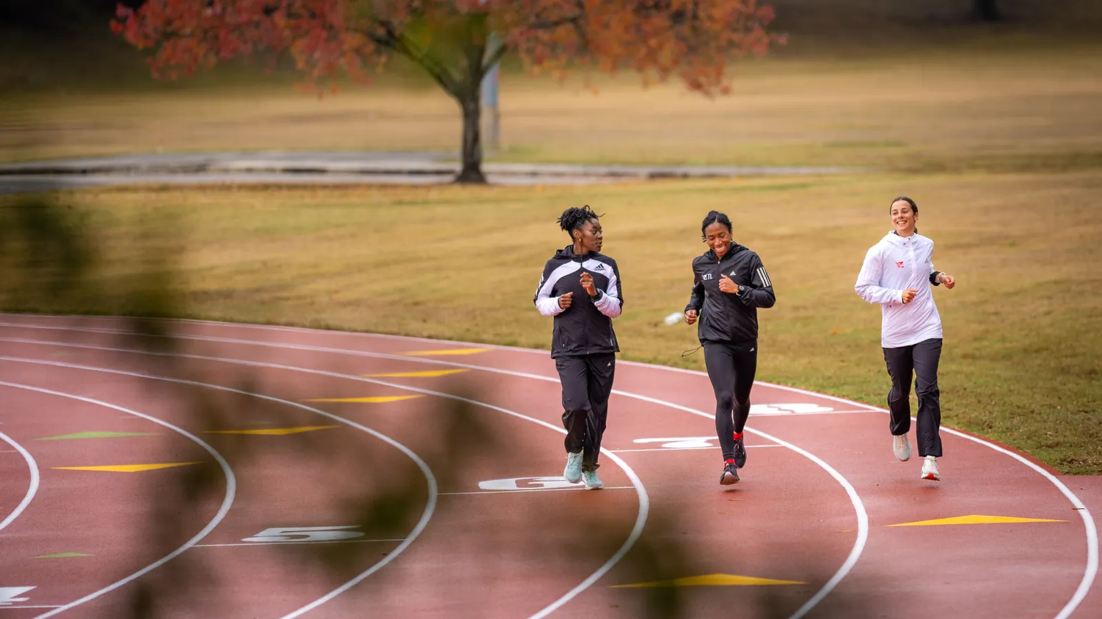 a group of people running on a track