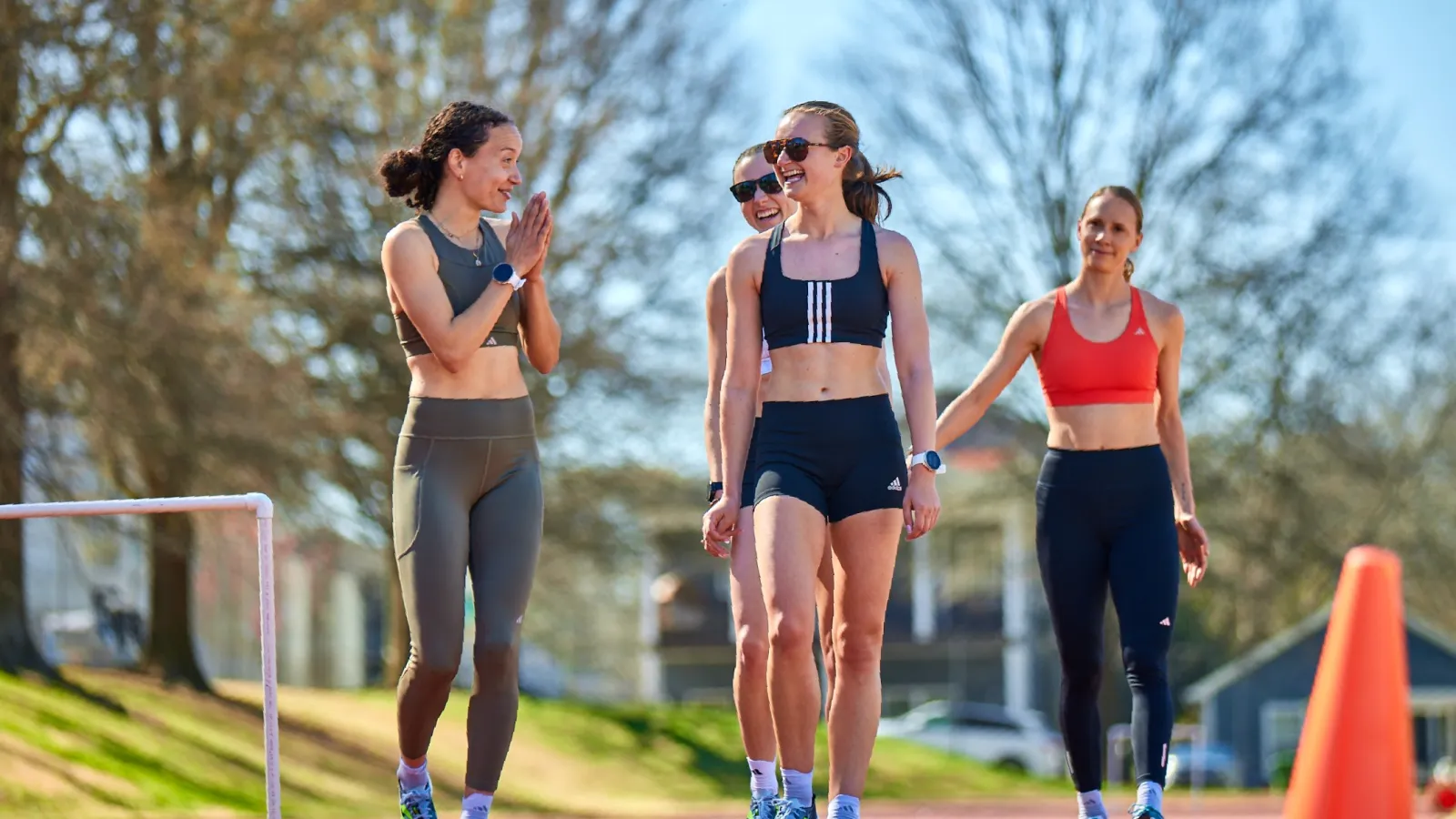 a group of women running on a track