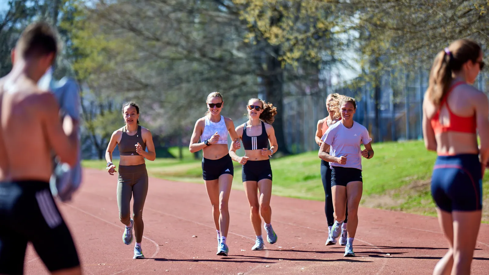 a group of people running on a road