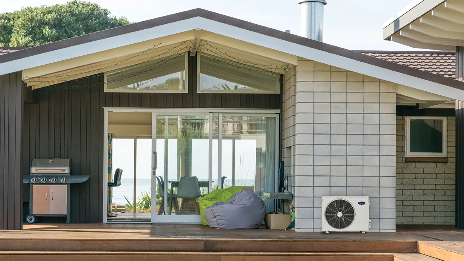 a house with a deck and a glass door