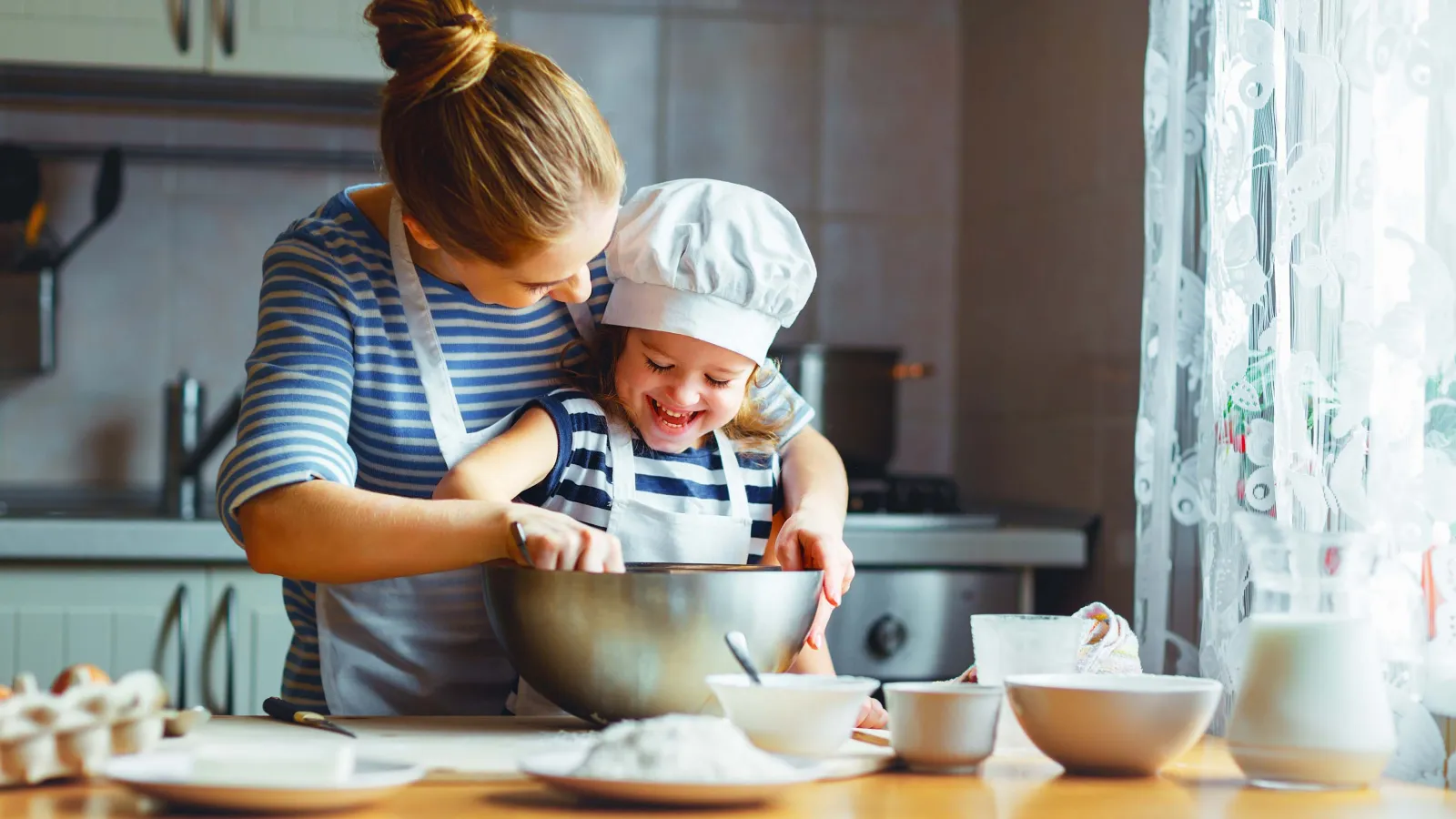 a person and a child cooking