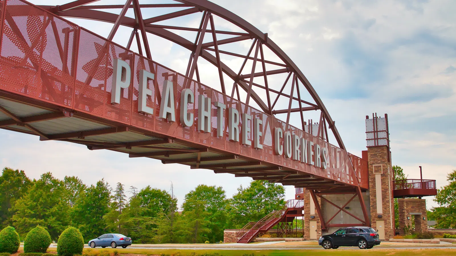 a large red sign over a road