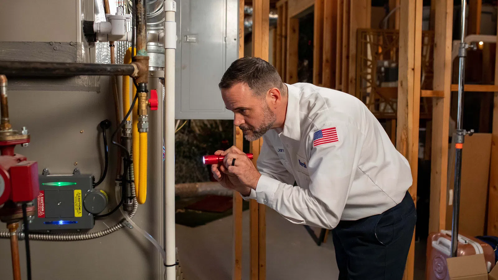 a technician inspecting a furnace