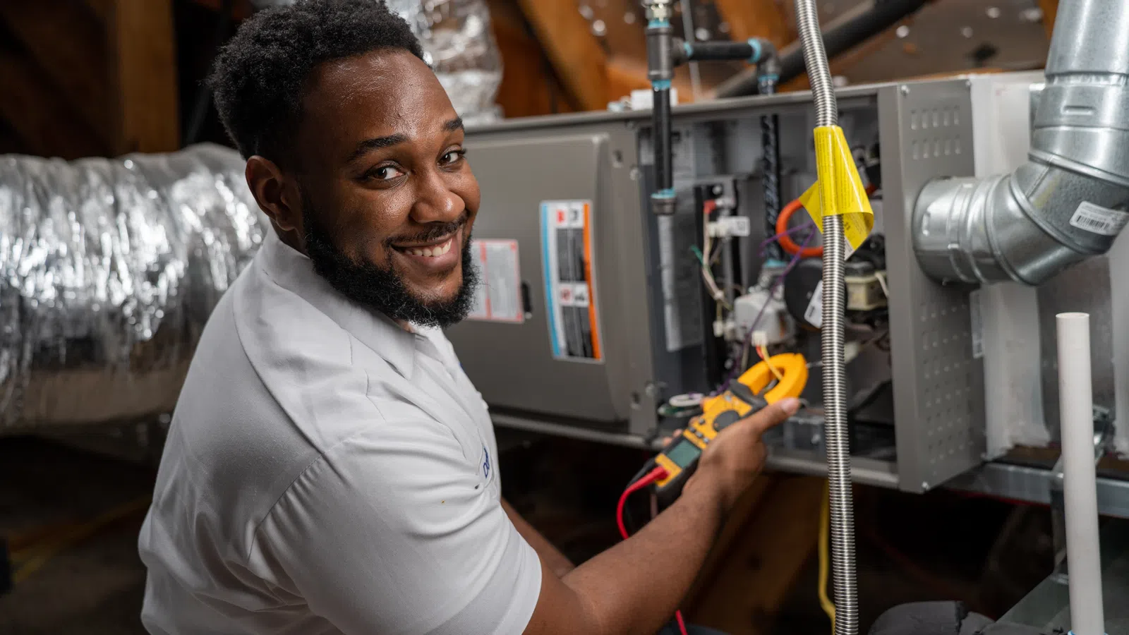 Bardi HVAC technician performing furnace tune-up and maintenance service