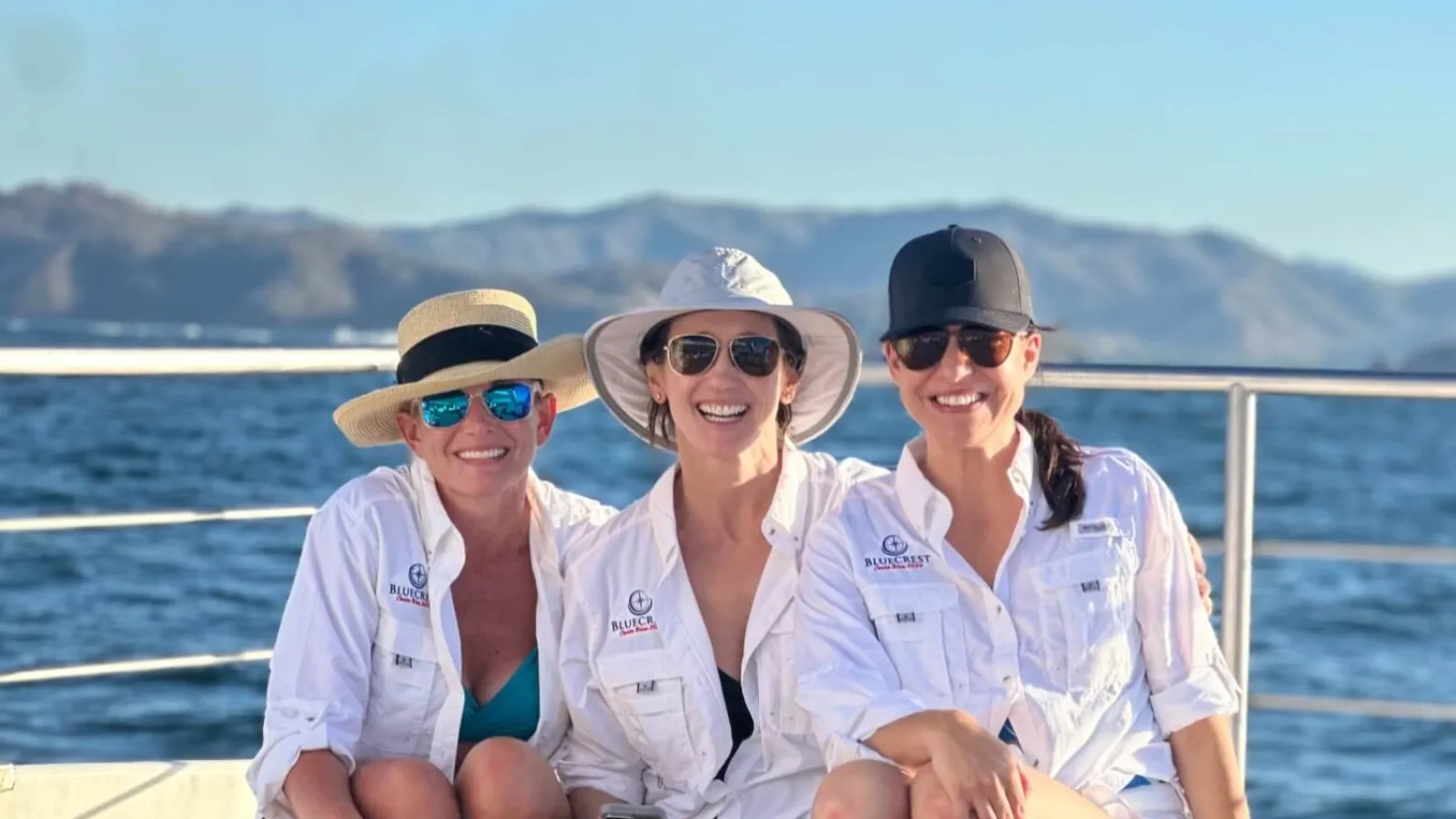 a group of women sitting on a boat