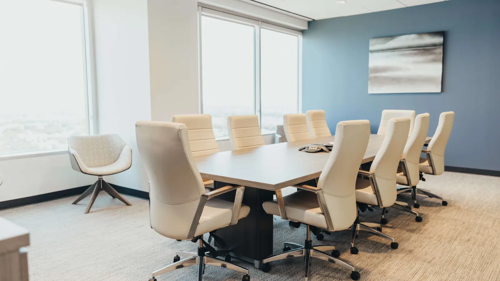 a conference room with a table and chairs