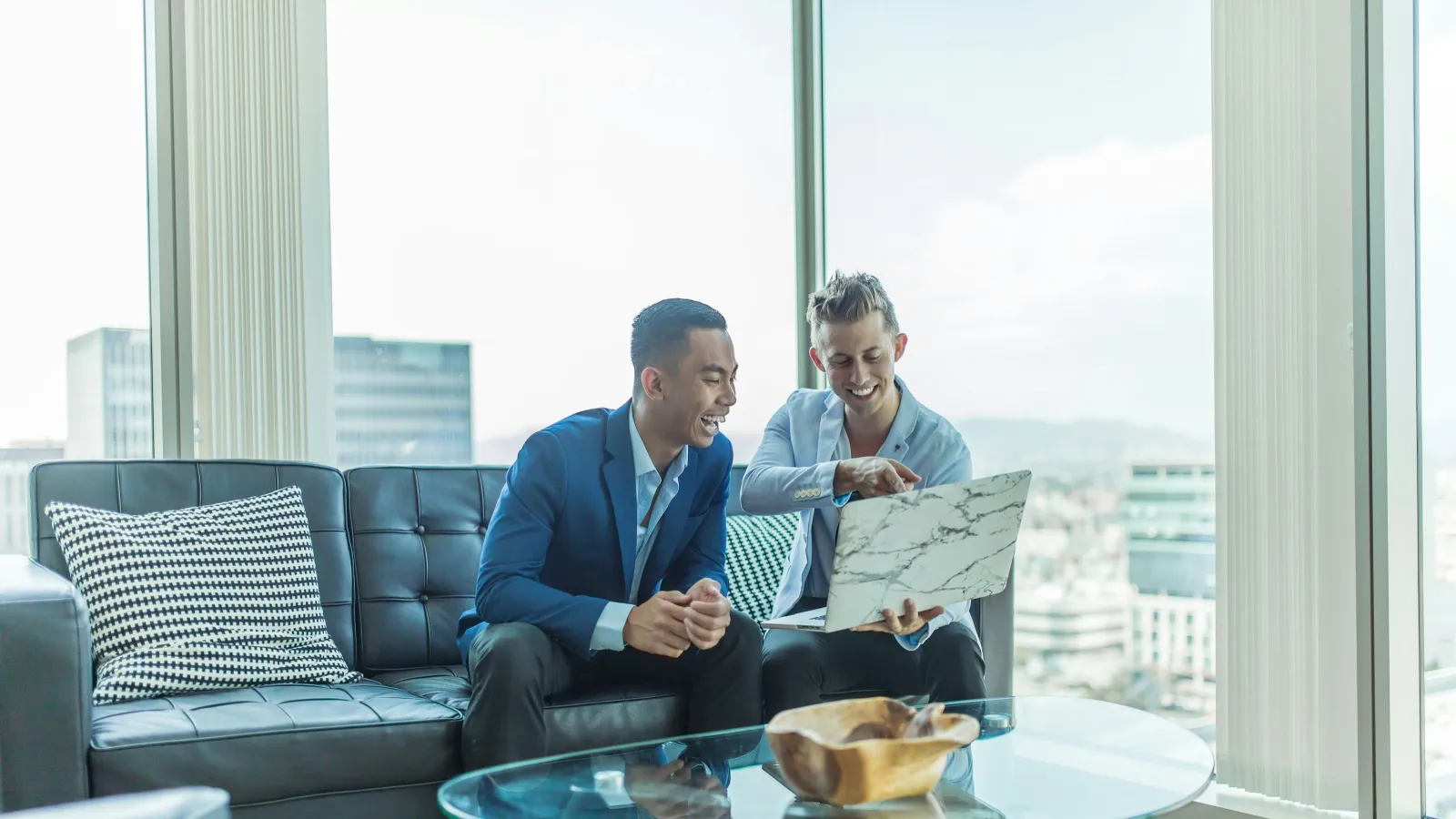men sitting on a couch
