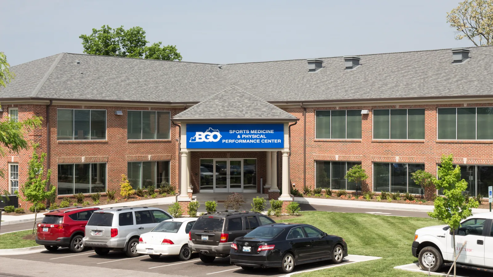 a building with cars parked in front