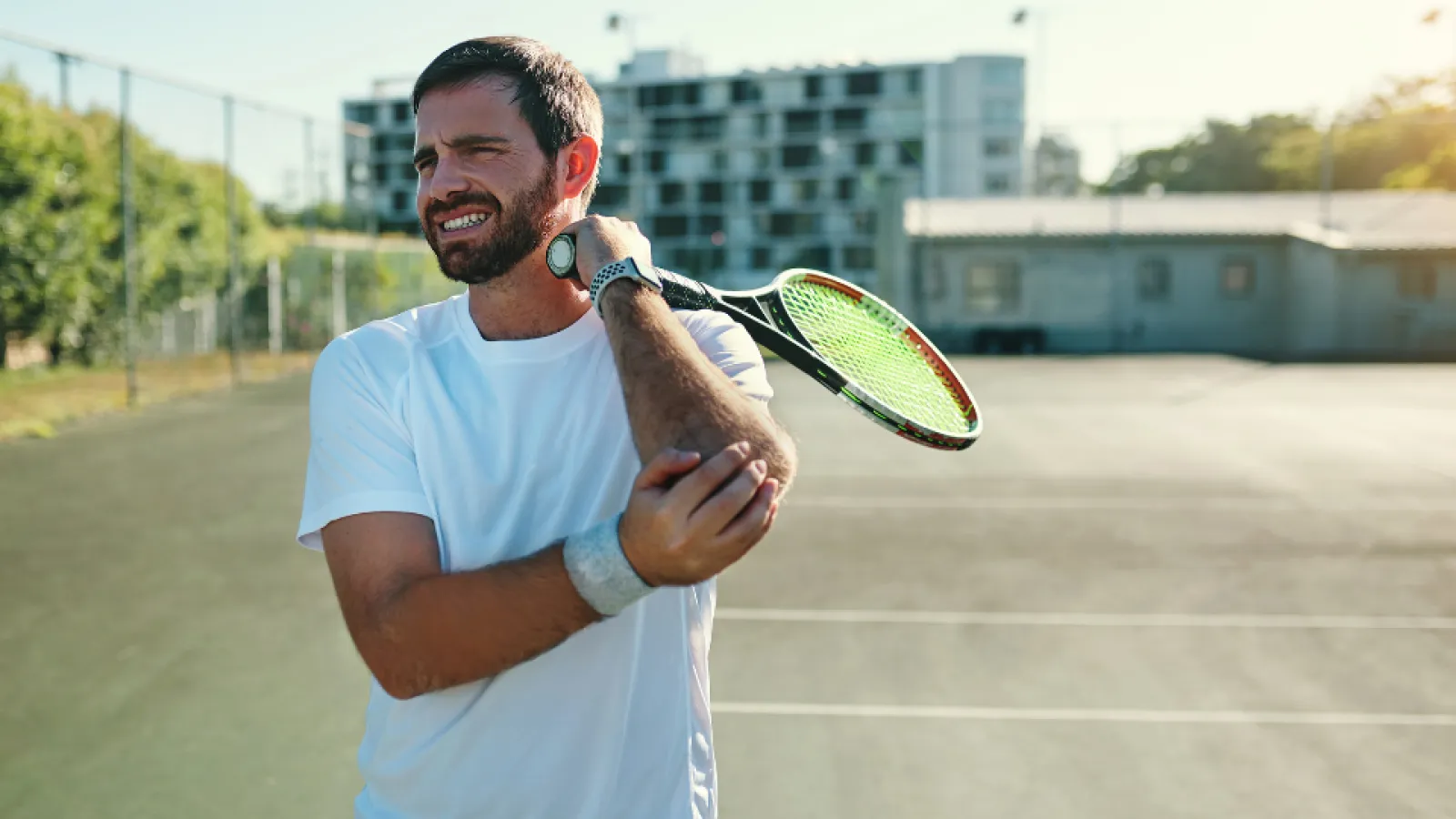 a man holding a tennis racket