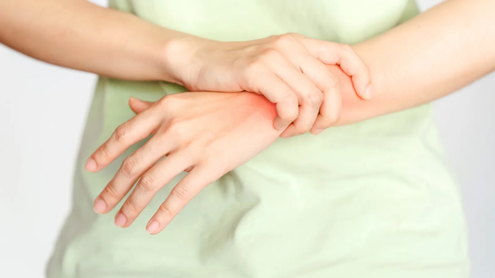 a close-up of hands holding a baby's hand