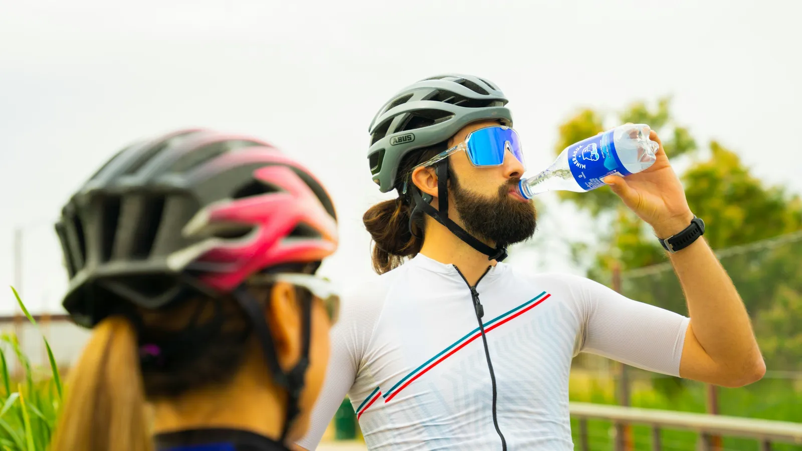 a person drinking from a bottle