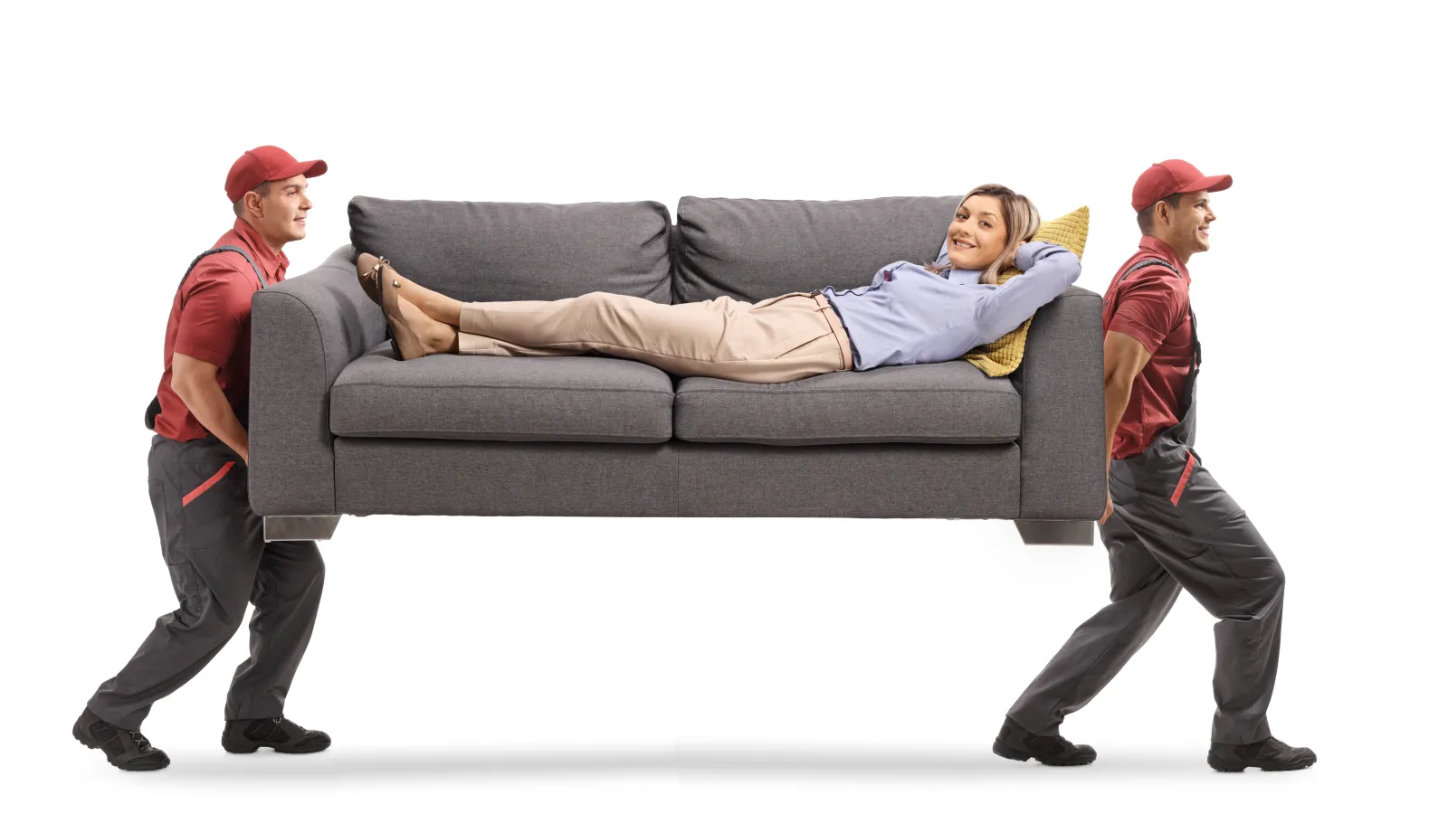 a man and a woman walking towards a couch