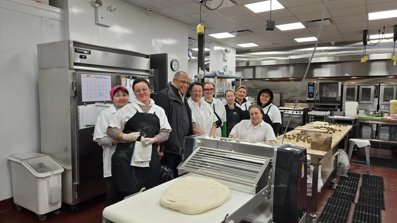 a group of people standing in a kitchen, restaurant consulting, Veselka