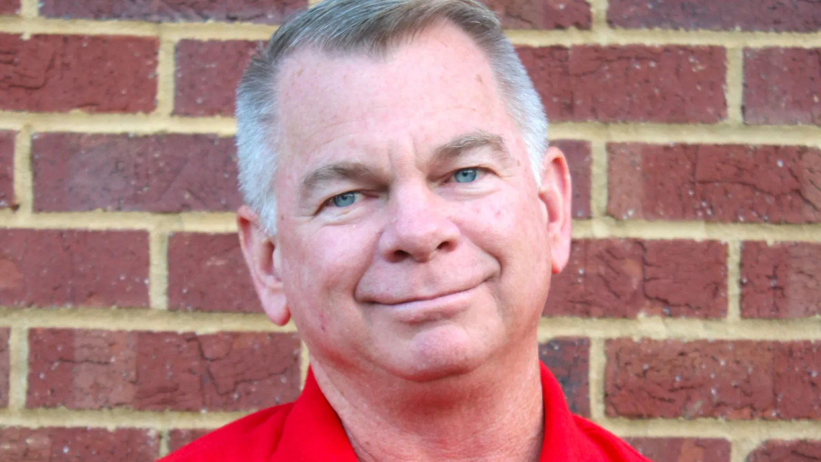 a man in a red shirt