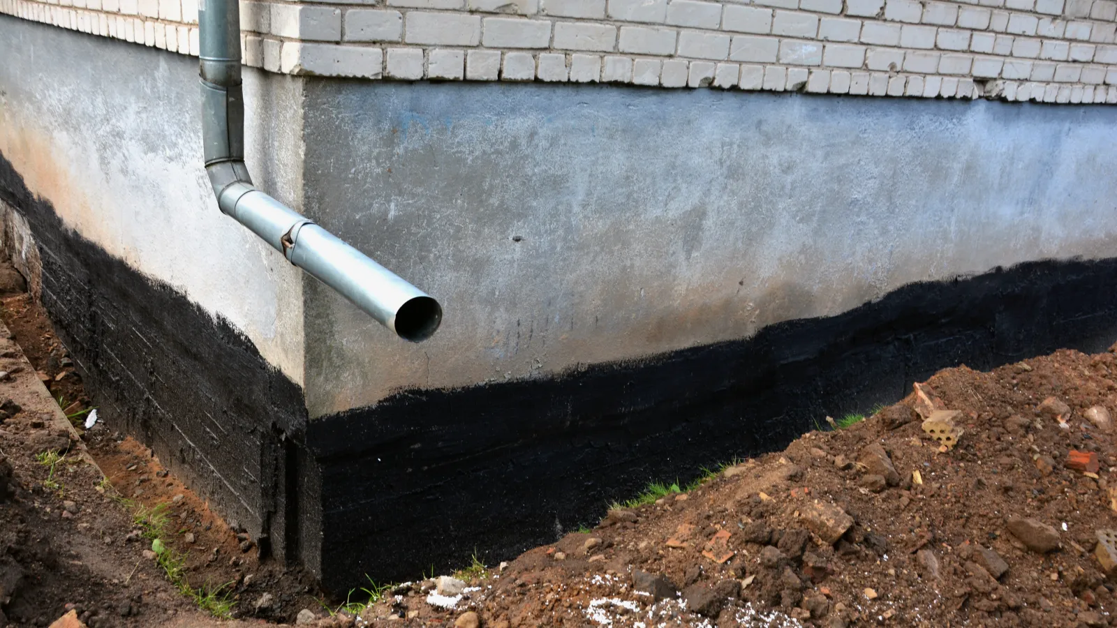 a pipe in a concrete wall