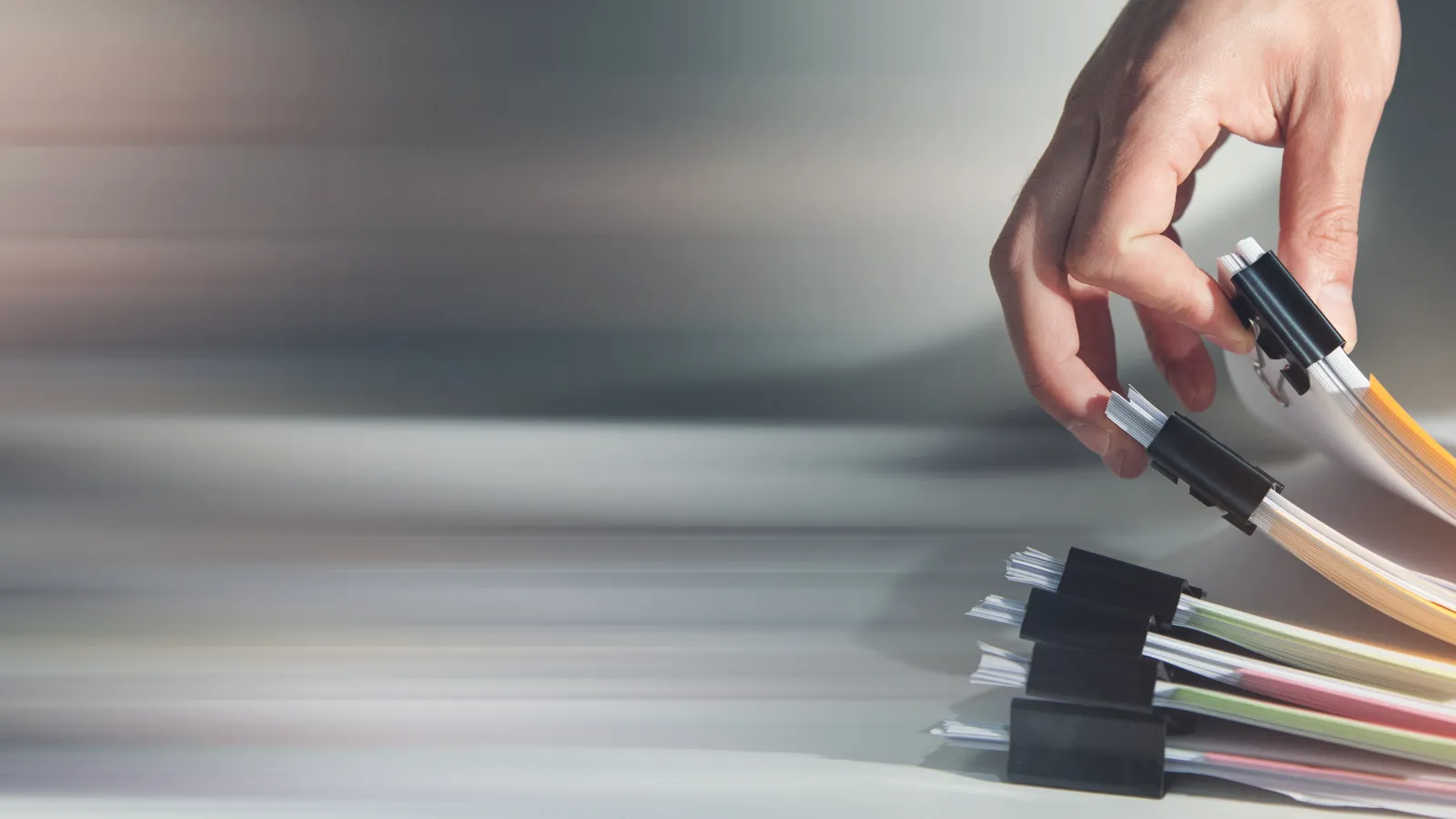 a person cutting a piece of paper