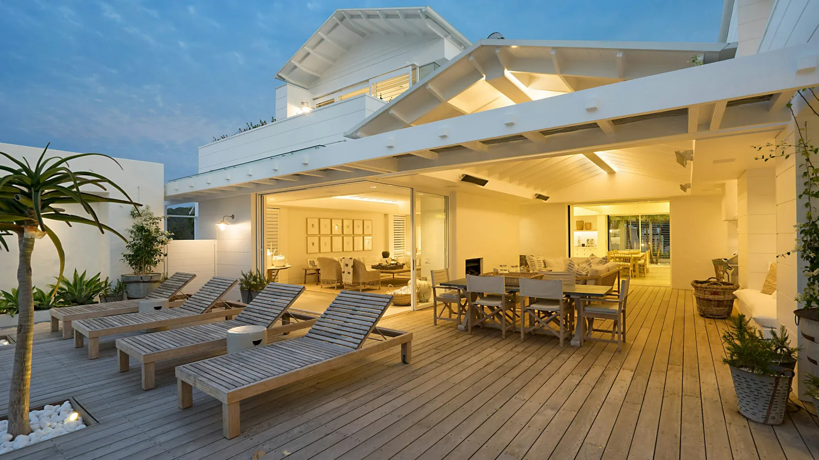 a house with a deck and chairs