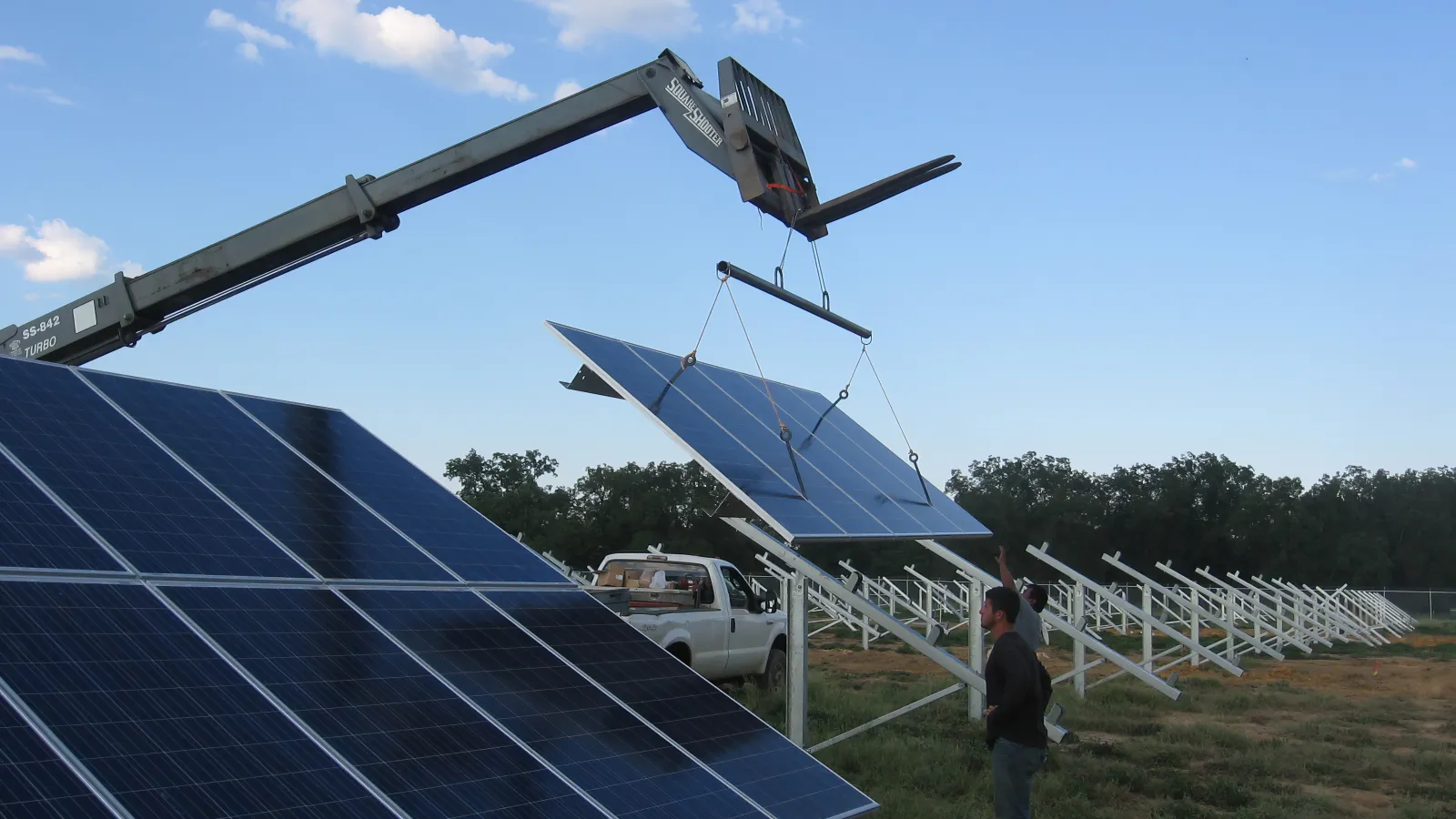 Installing solar panels on helical ground supports